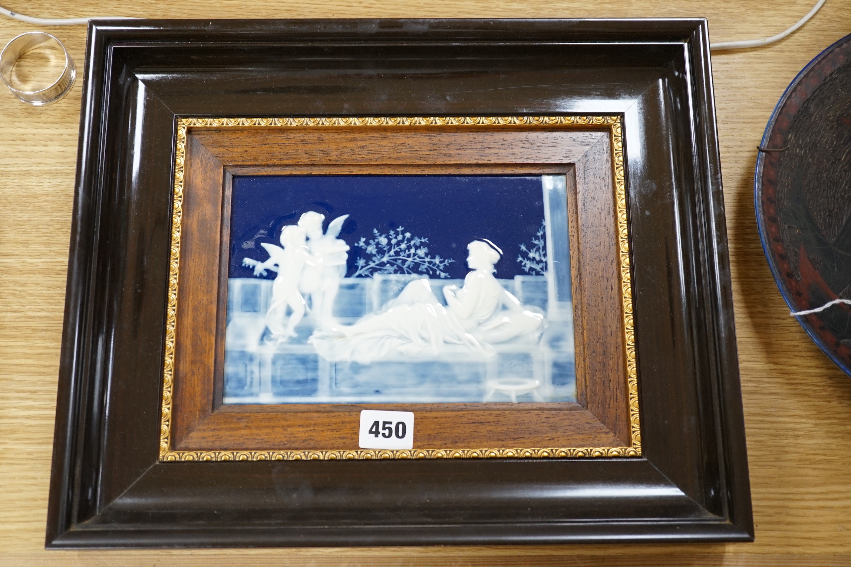 A framed pate sur pate panel, signed Chaufriase, recumbent female, Limoges, 20.5cm x 15cm